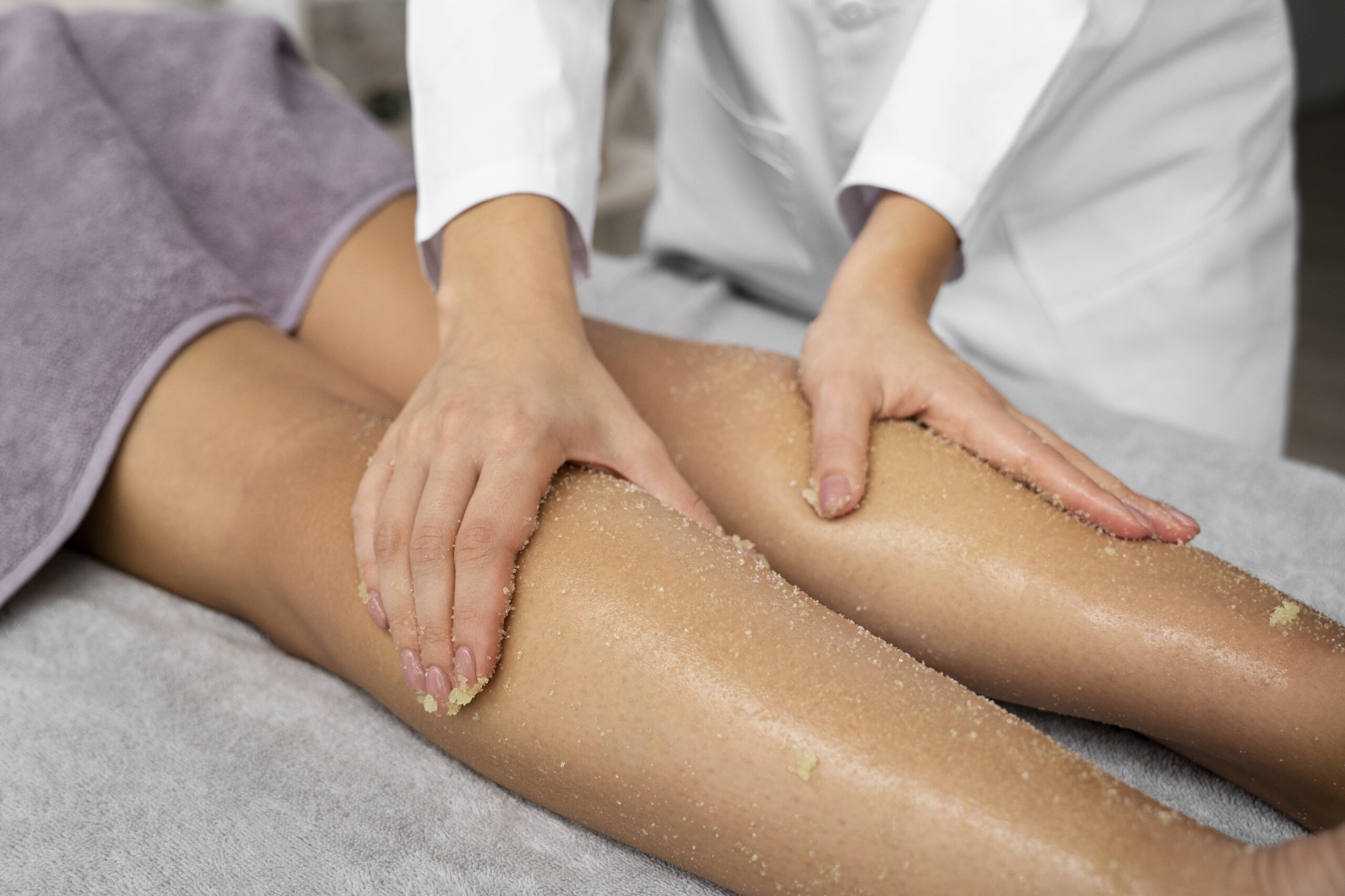 high-angle-woman-getting-massaged-spa